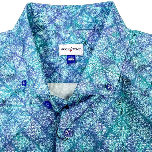 Blue patterned shirt with a visible brand label on a white background
