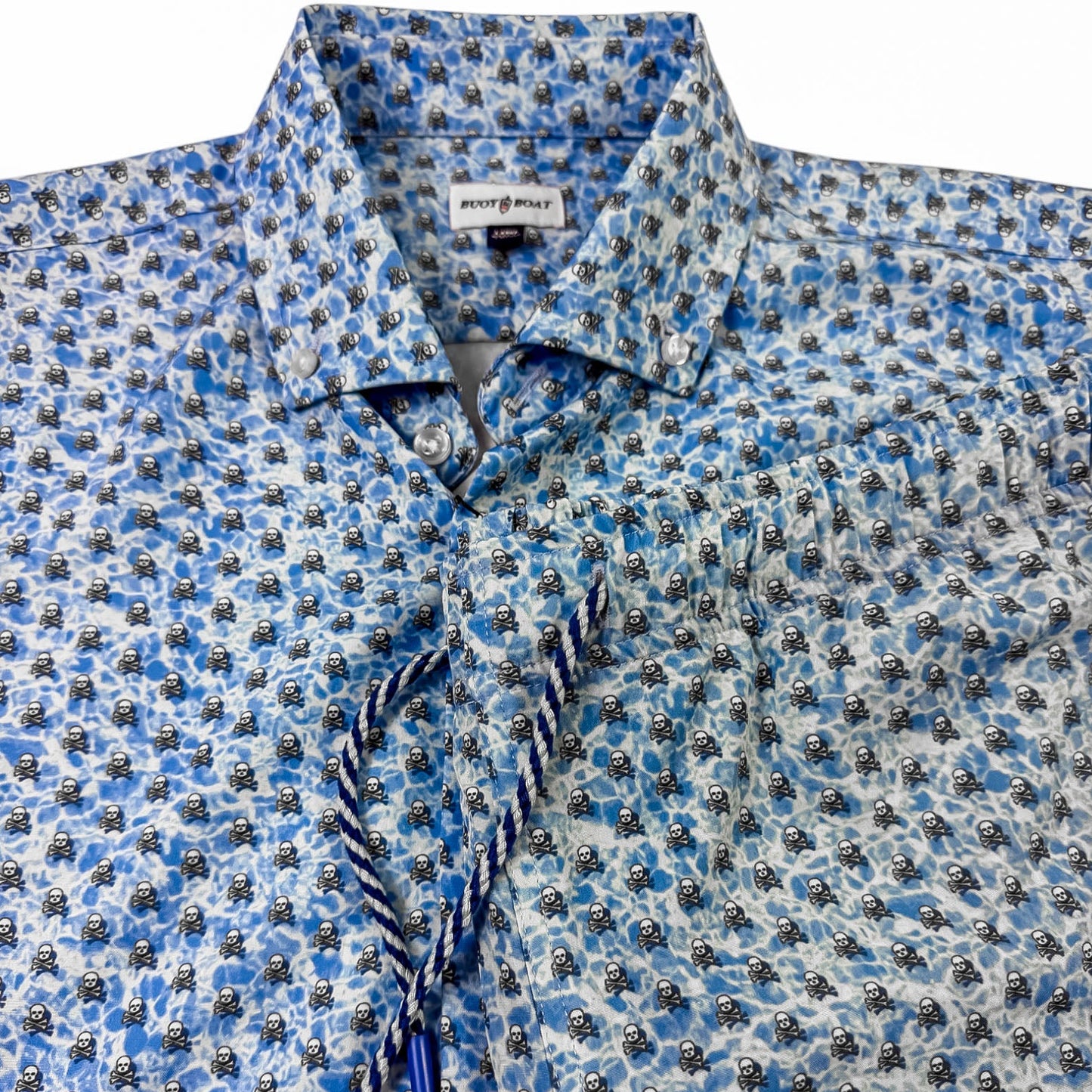 skull and crossbones patterned shirt and shorts on a white background