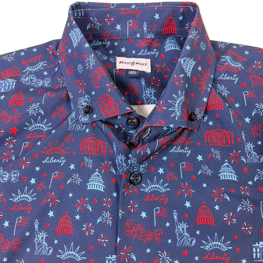 Blue shirt with red and white Liberty-themed pattern on a beige background