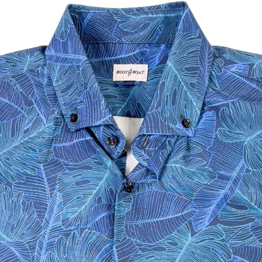 Blue leaf-patterned shirt on a plain background
