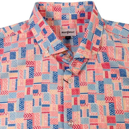 Colorful patterned shirt with geometric design on a beige background