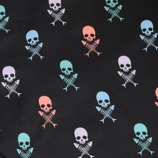 Skulls & Fish Bones boardshorts graphic pattern detail close up