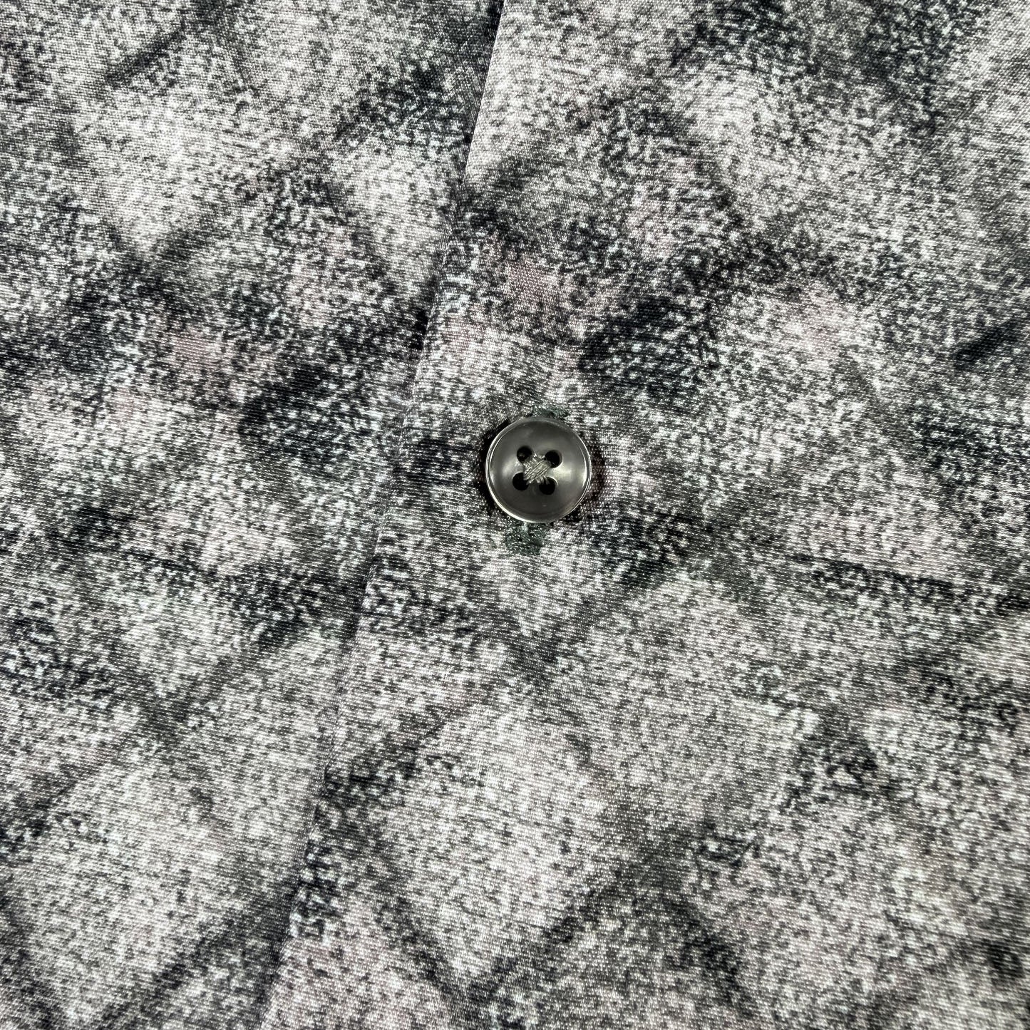 Close-up of a textured fabric with a button in the center