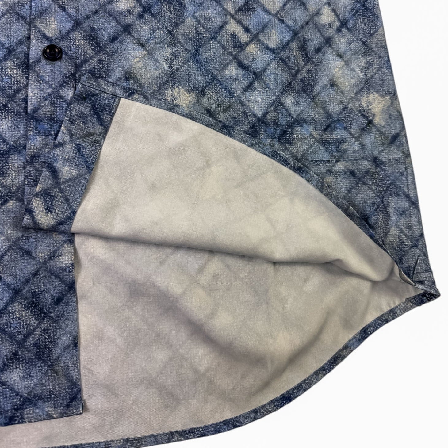 Close-up of a blue shirt with a white interior on a white background