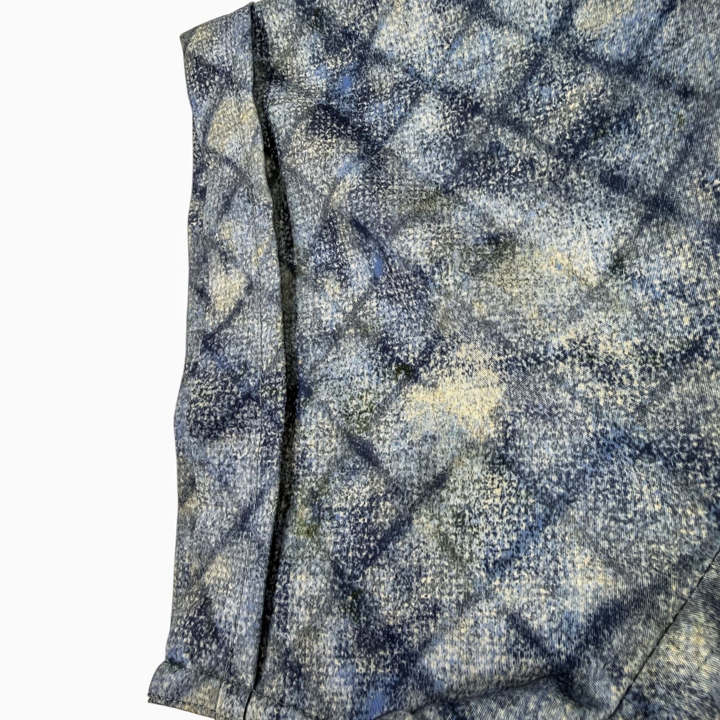 shirt sleeve with a blue and gray checkered pattern on a white background