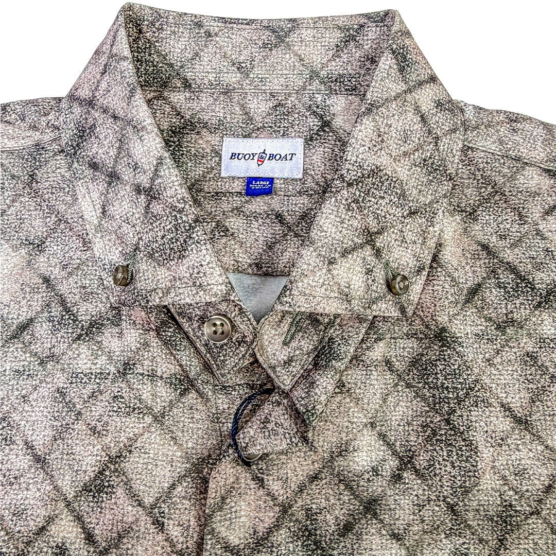 Patterned shirt with a brand label on a white background