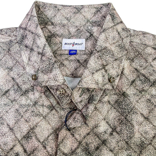 Patterned shirt with a brand label on a white background