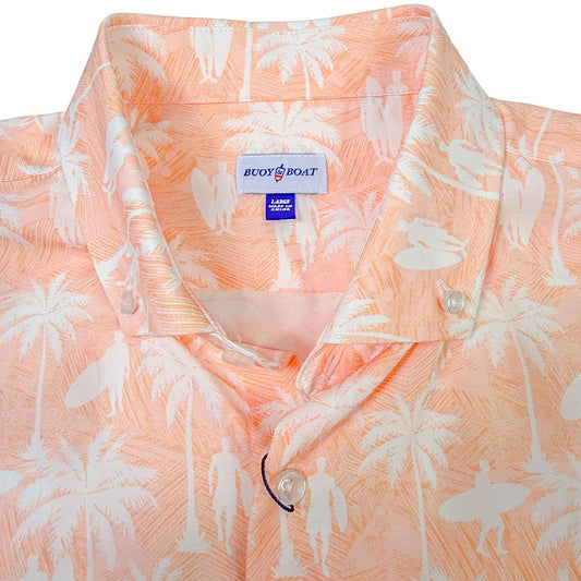 Peach-colored shirt with white palm tree and surfer pattern, featuring a 'Buoy Boat' label.