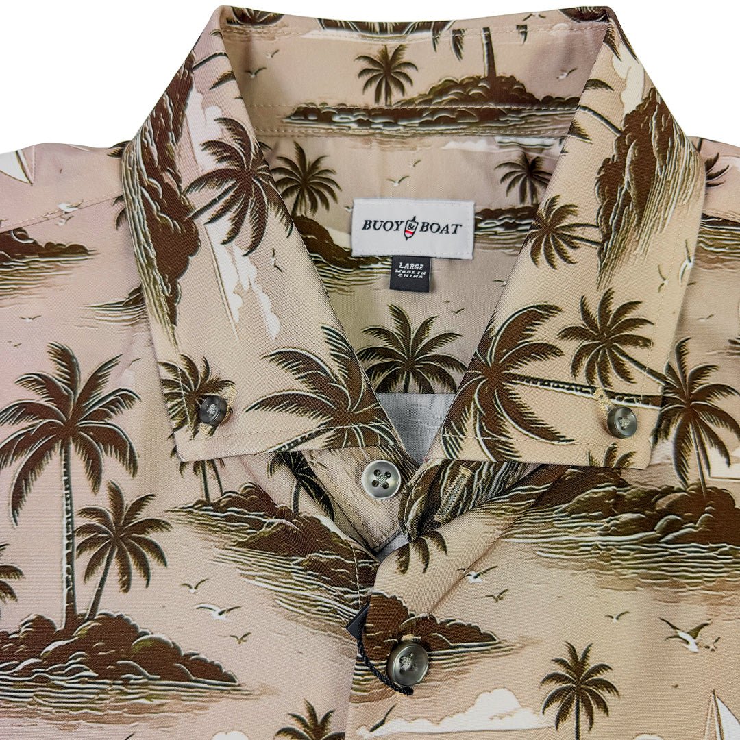 Hawaiian shirt with palm tree design and 'Buddy & Boat' label on a white background