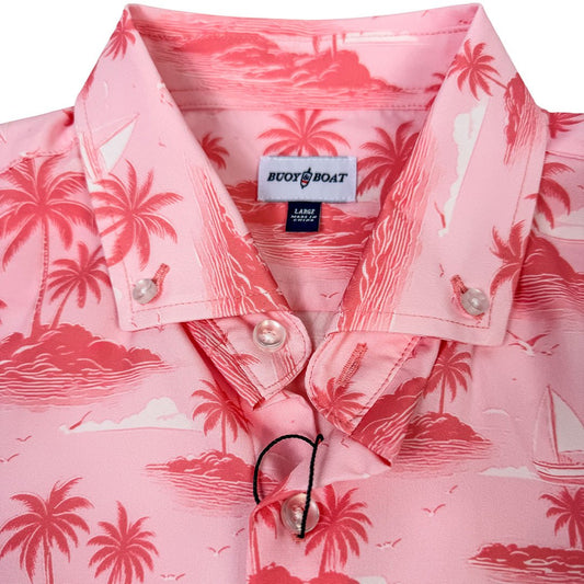 Pink shirt with tropical pattern and 'Buddy Boat' label on a white background
