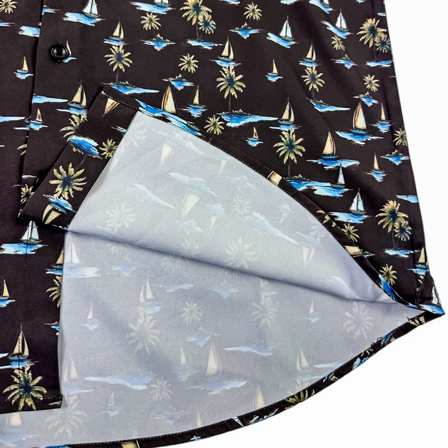 Close-up of a shirt with a tropical pattern on a white background