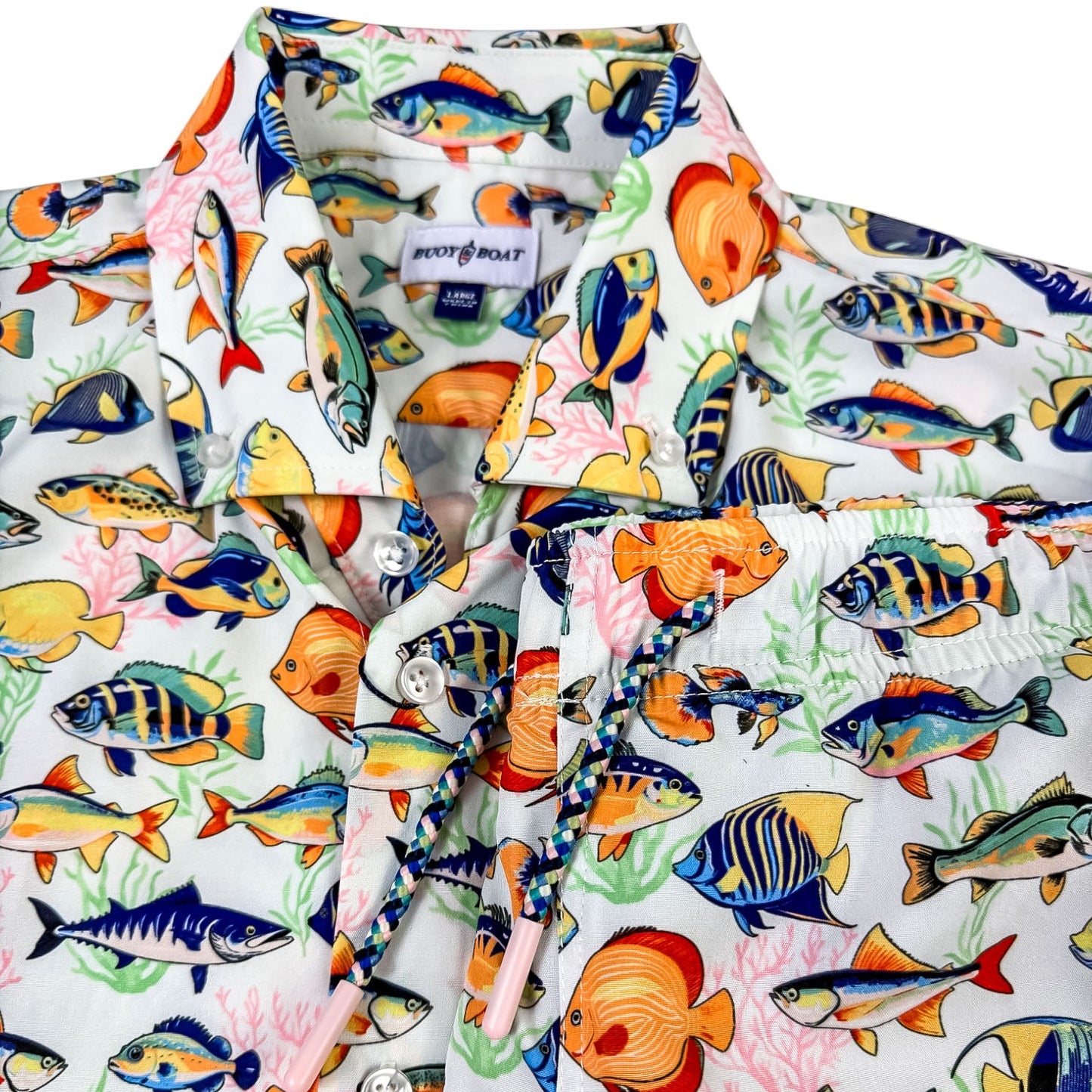 Colorful fish-patterned shirt on a white background