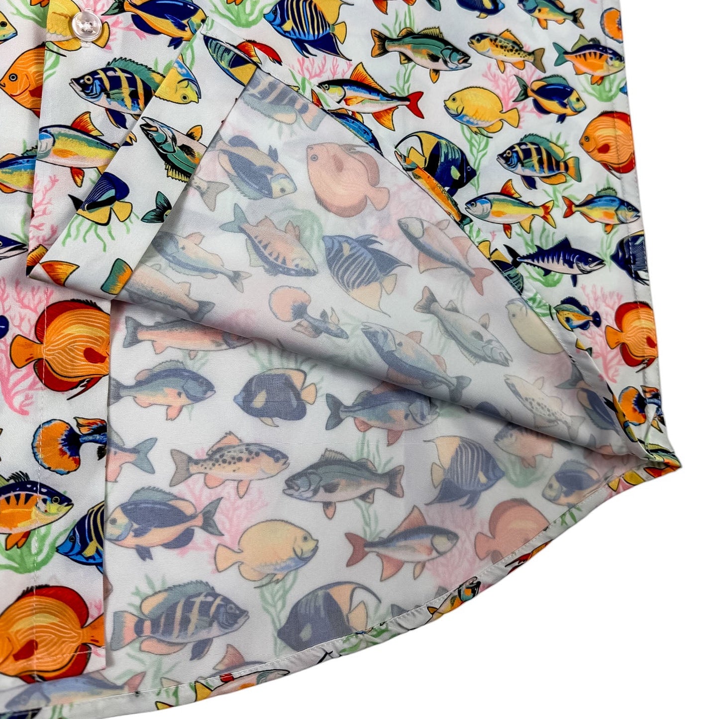 Two fabric swatches with colorful fish pattern on a white background