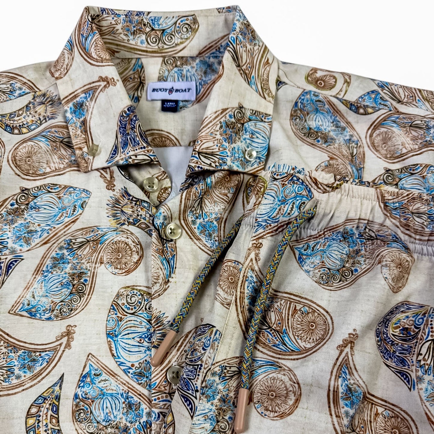 Patterned shirt with a visible brand label on a white background
