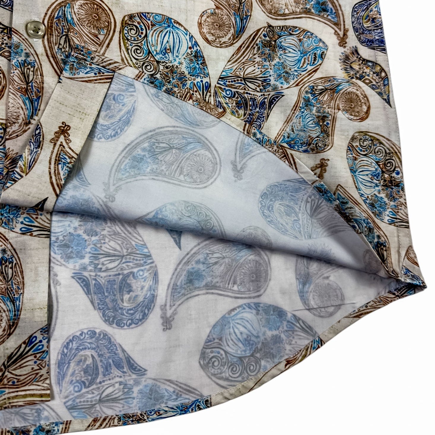 Folded shirt with paisley pattern on a white background