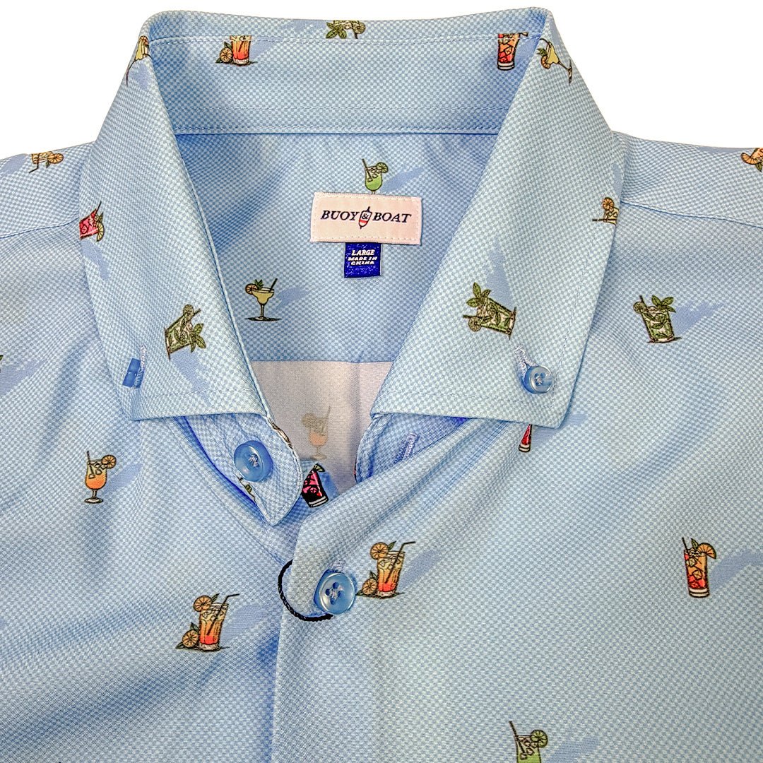 Light blue dress shirt with cocktail-themed embroidery on a white background