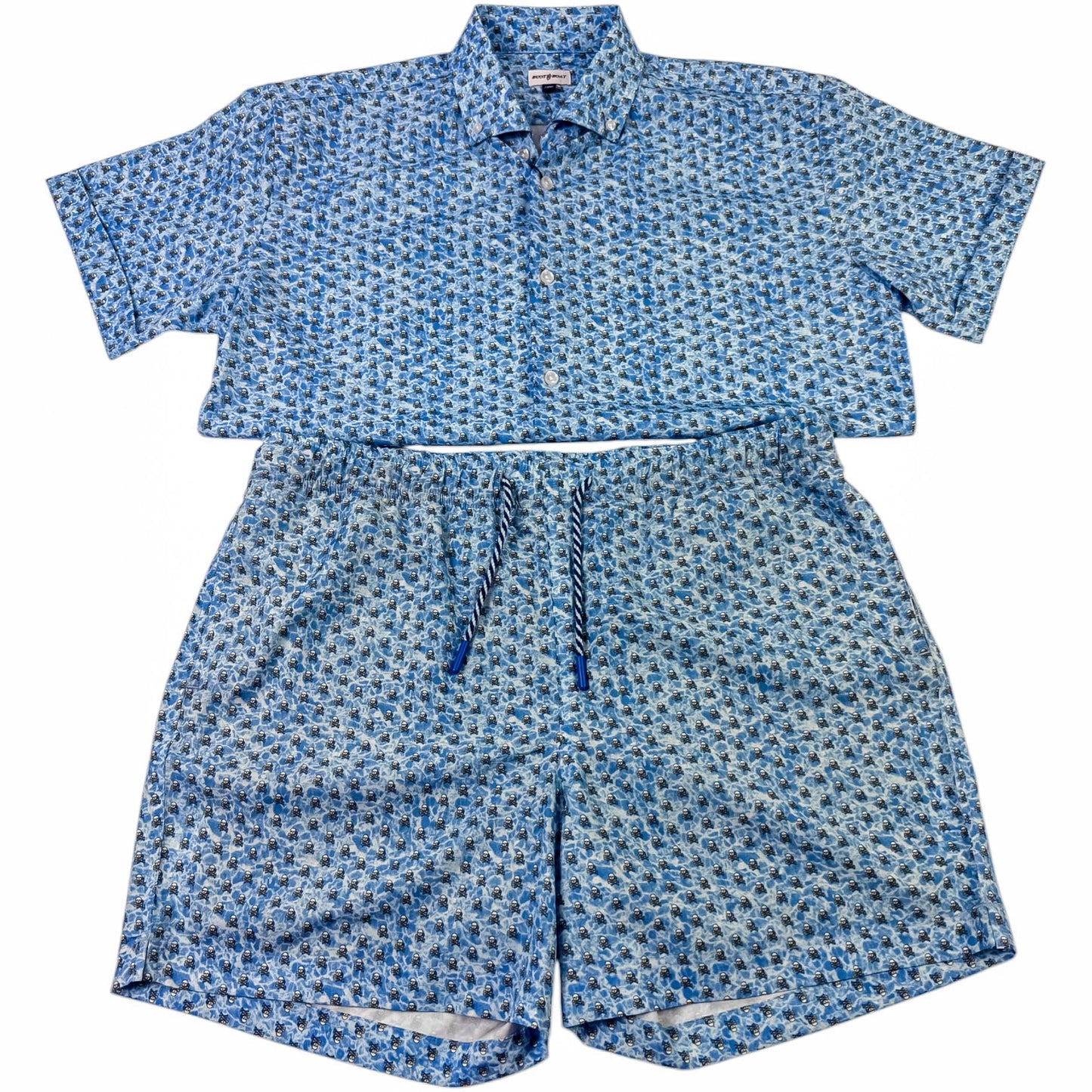 Blue patterned shirt and shorts set on a white background