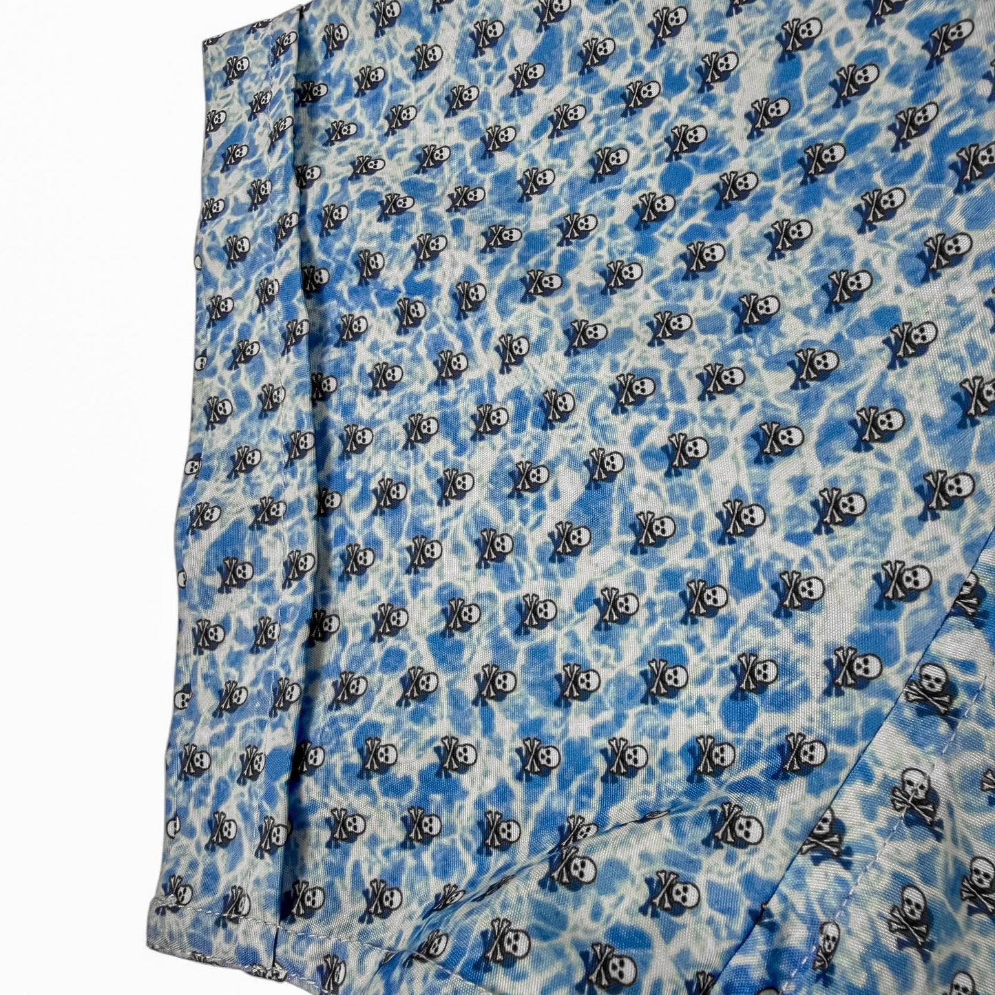 Blue fabric with black and white pattern on a white background