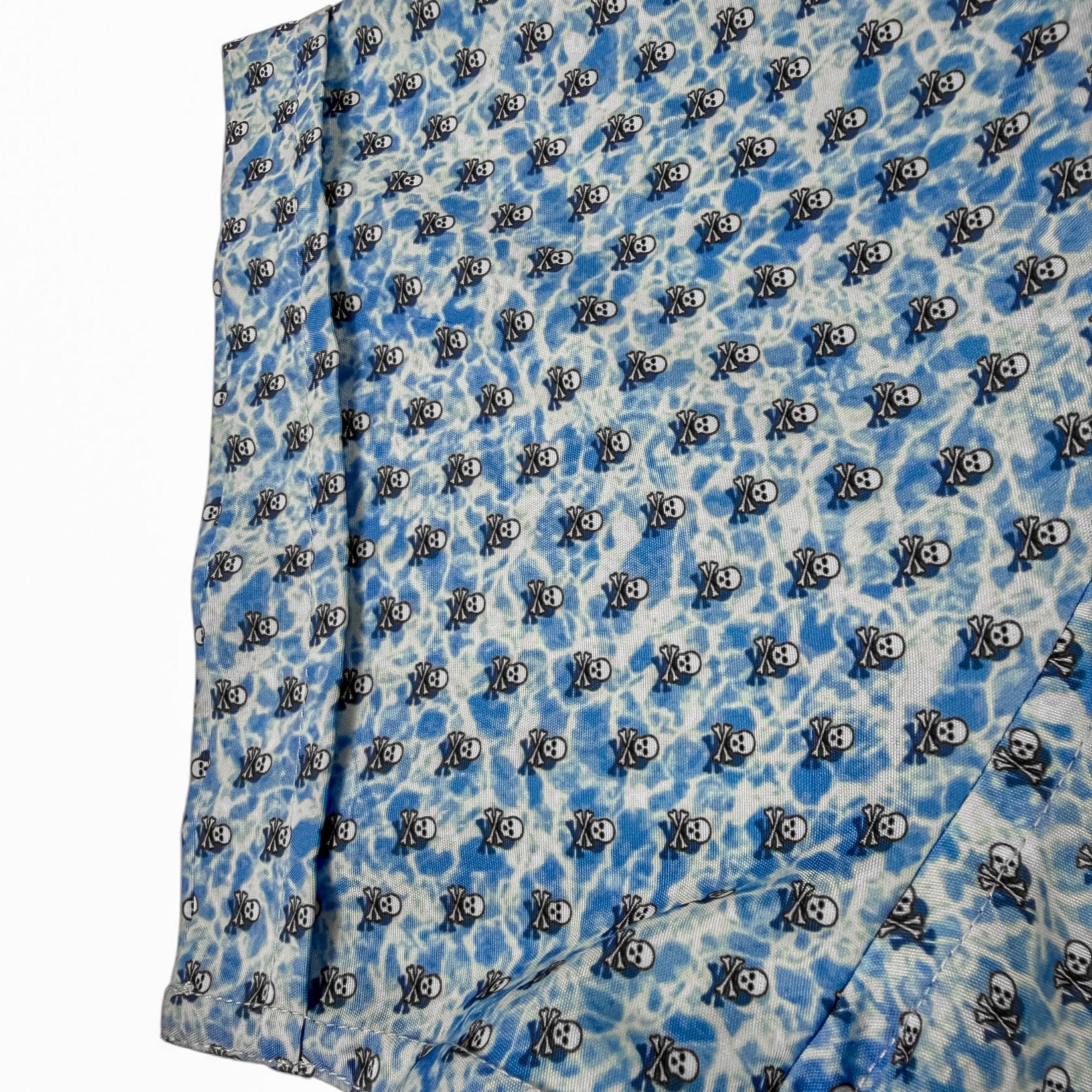 Blue fabric with black and white pattern on a white background