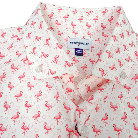 Pink flamingo patterned shirt with a brand label on a white background