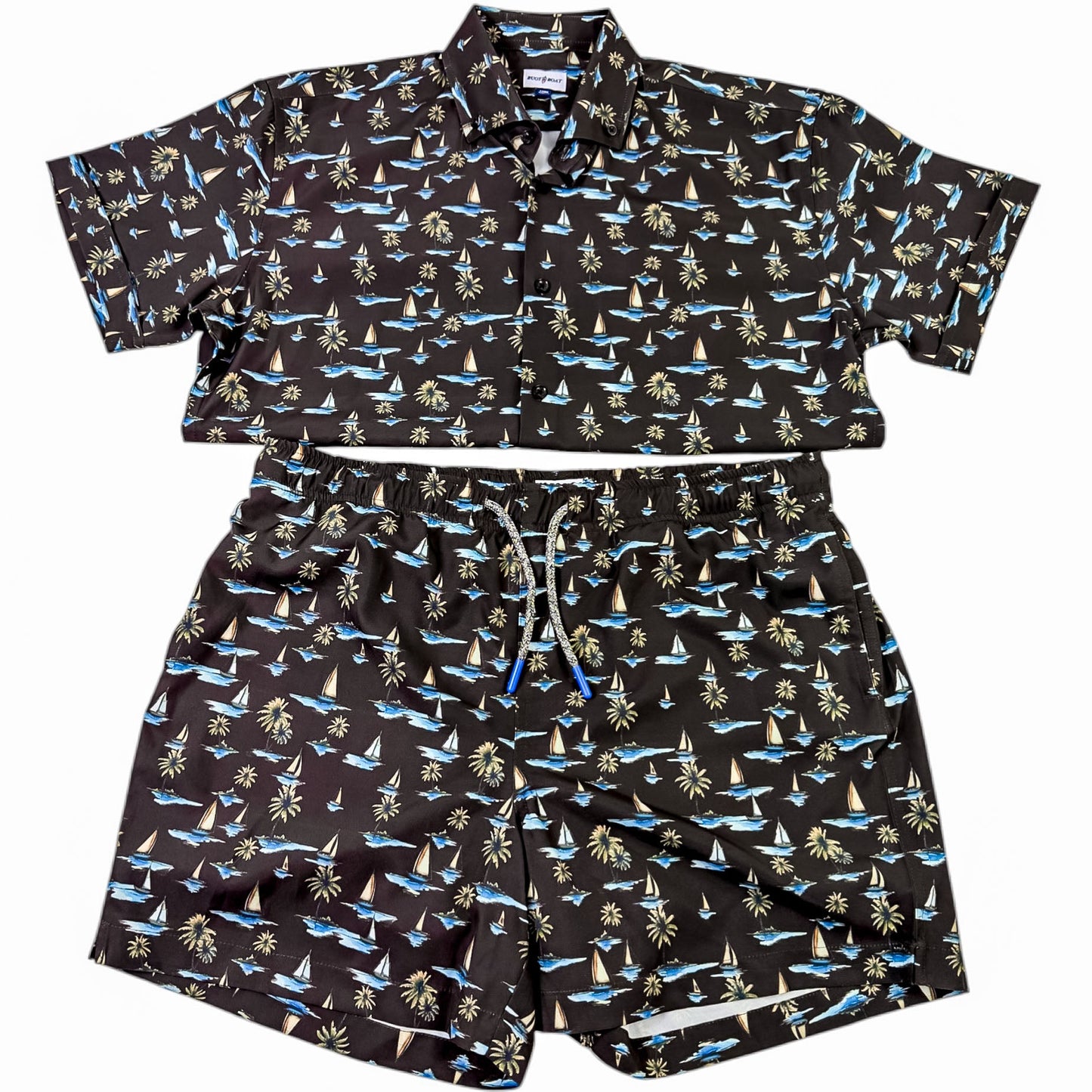 Black patterned shirt and shorts set on a white background