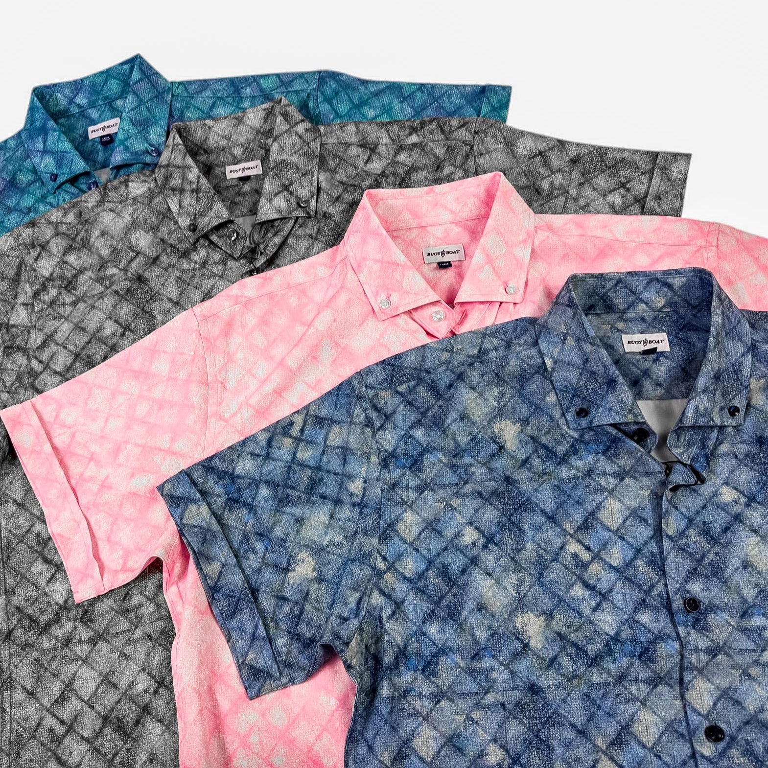 Four patterned shirts in blue, gray, pink, and blue plaid on a white background