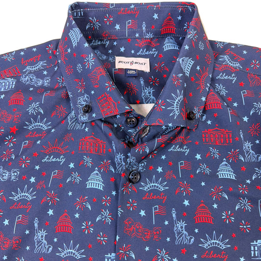 Blue shirt with red and white Liberty-themed pattern on a beige background