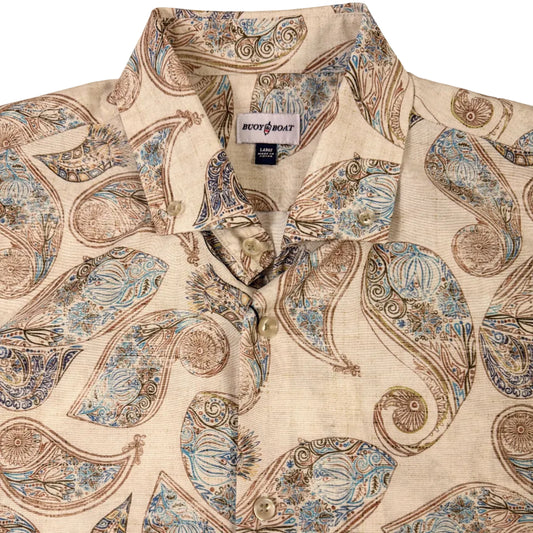 Beige shirt with intricate paisley pattern on a beige background