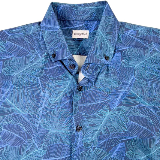 Blue leaf-patterned shirt on a plain background