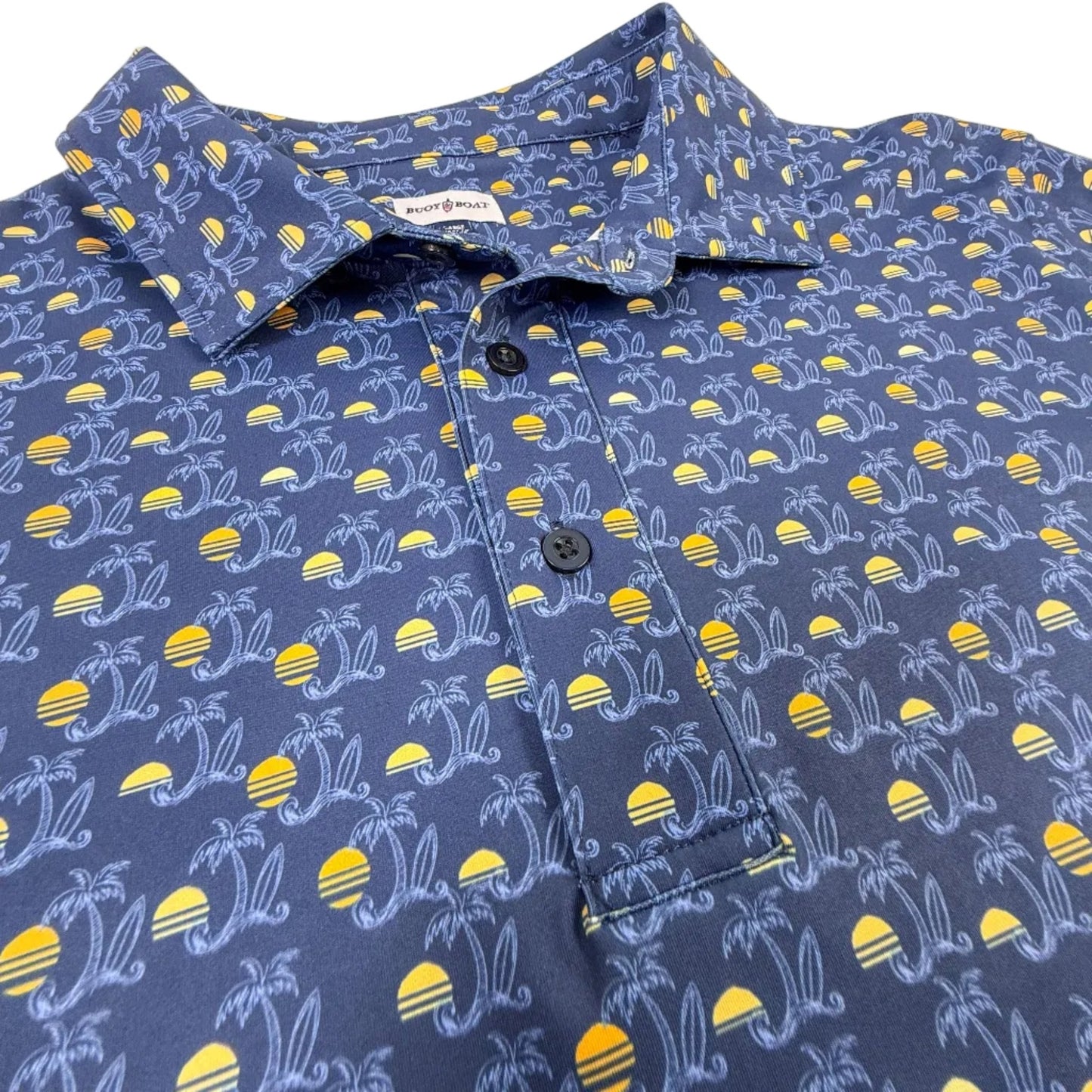 Blue shirt with yellow and white pattern on a white surface