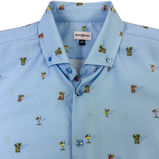 Light blue shirt with small embroidered patterns on a beige background