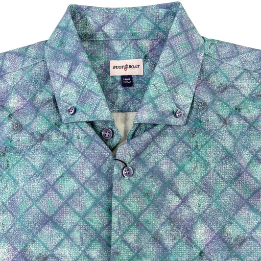 Plaid shirt with a visible brand label on a beige background