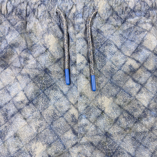 Close-up of blue patterned fabric with drawstring