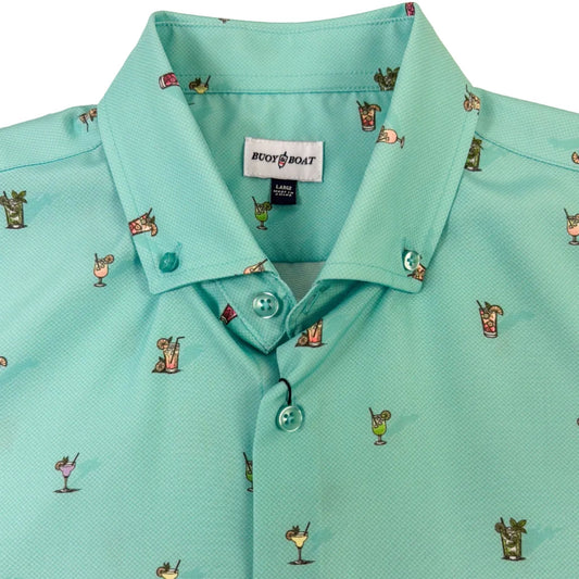Teal shirt with small printed designs on a white background