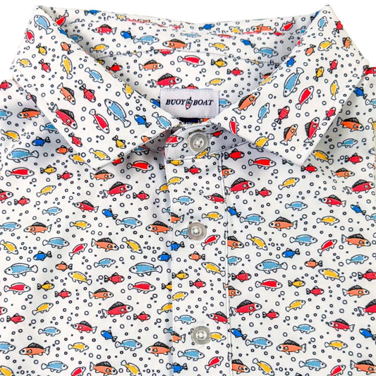 Folded shirt with colorful car pattern on a light background