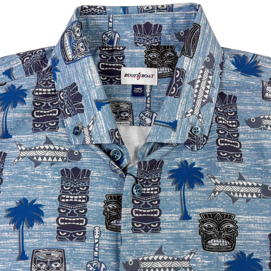 Blue patterned shirt with tiki designs on a white background