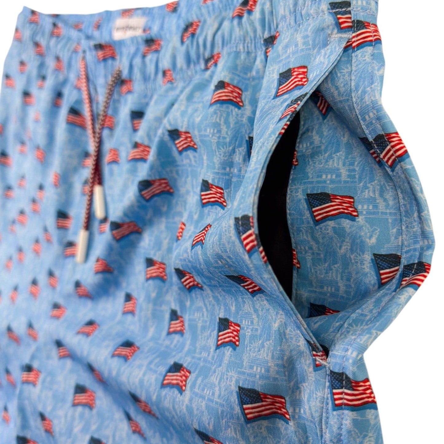 Blue shorts with American flag pattern on a white background