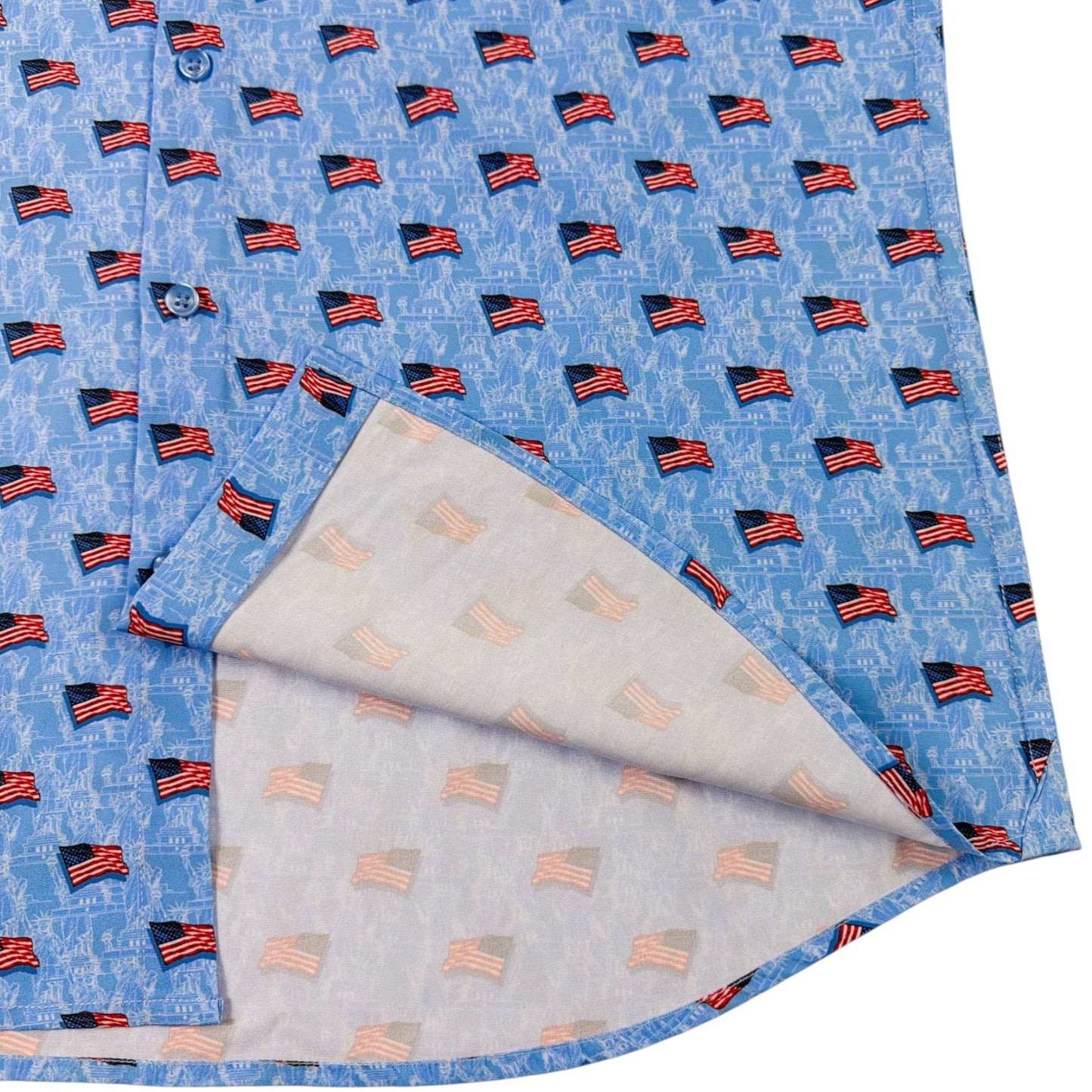 Folded fabric with small American flag pattern on a blue background