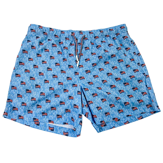 Blue swim shorts with American flag pattern on a white background