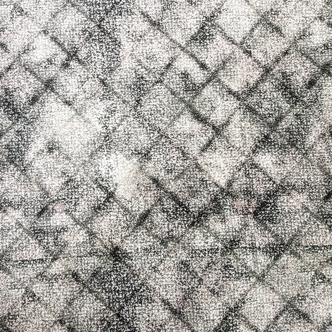 Textured black and white fabric of a woven shirt