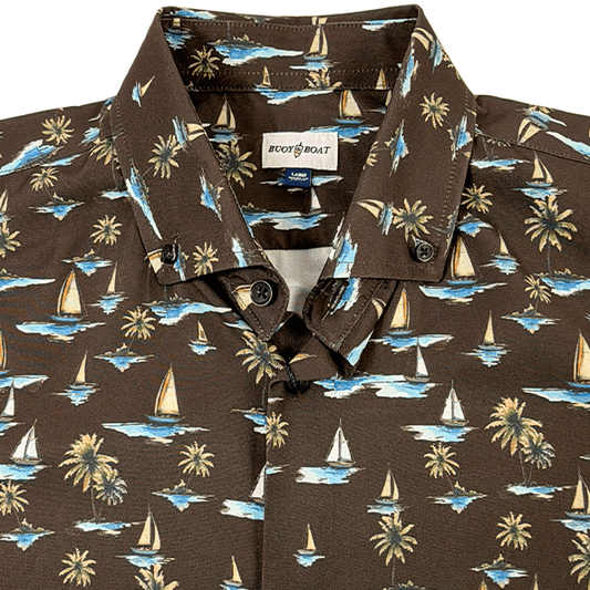 Hawaiian shirt with sailboat and palm tree pattern on a brown background