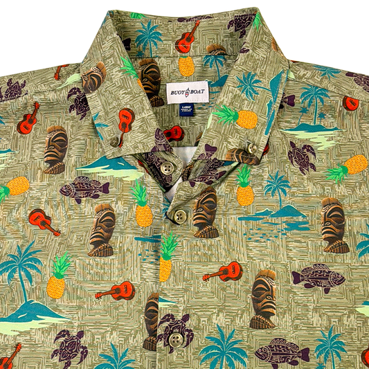 Hawaiian shirt with tropical pattern featuring guitars, palm trees, and fish on a beige background.