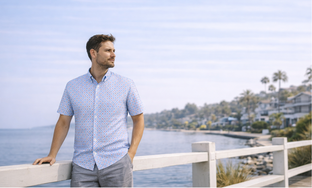 Buoy & Boat men’s short-sleeve button-down shirt worn along a coastal boardwalk in spring